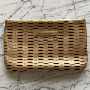 Ivanka Trump gold and black clutch